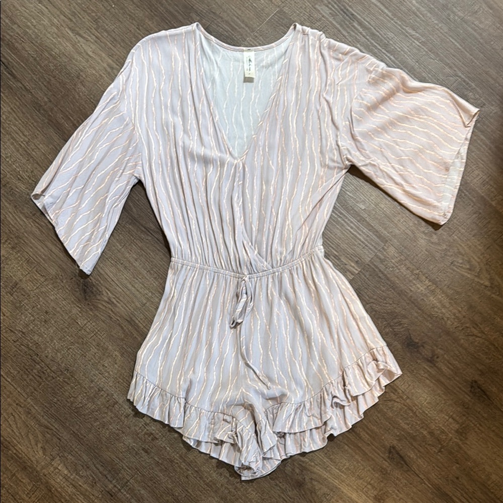 Elegant Pink Romper with Ruffle Hem